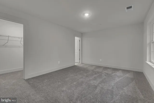 a bathroom with a sink toilet vanity and shower