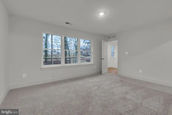 a bathroom with a sink toilet vanity and shower