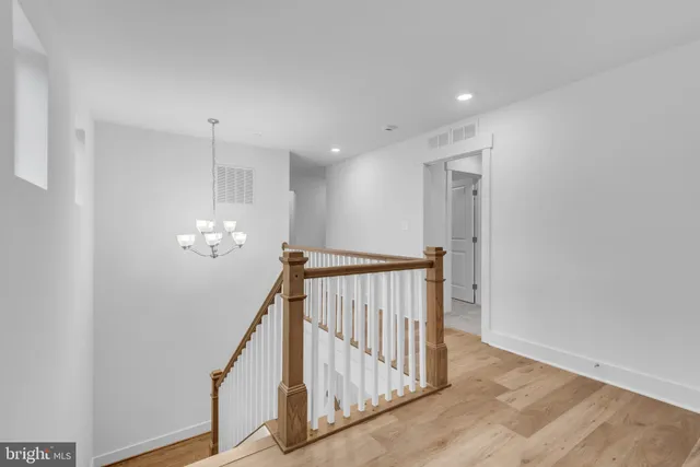 a view of a hallway with stairs