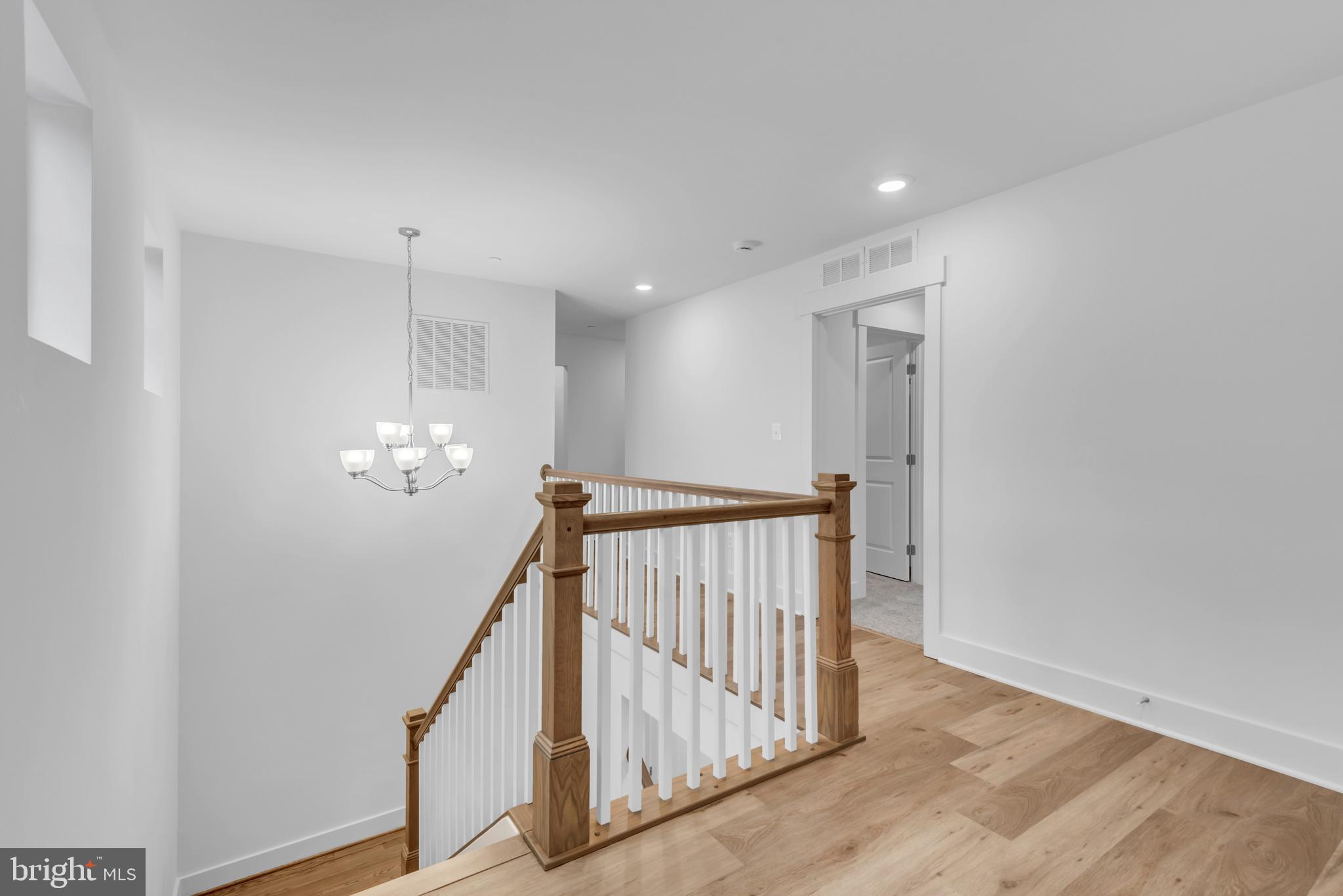 6502 Whitetail Xing Way Hanover, MD 21076 - Photo 23 of 54 a view of a hallway with stairs