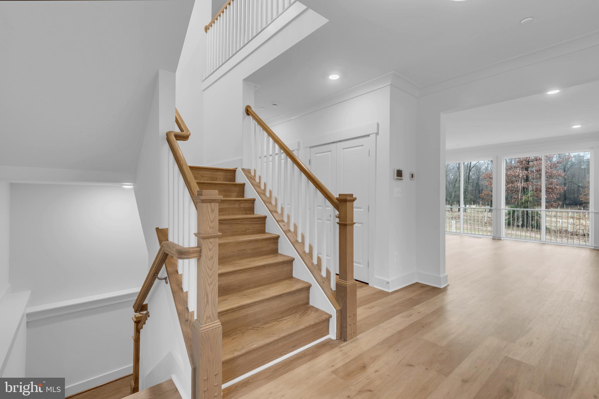 6502 Whitetail Xing Way Hanover, MD 21076 - Photo 41 of 54 a view of staircase with wooden floor and white walls