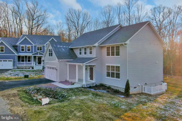 a aerial view of a house with a yard
