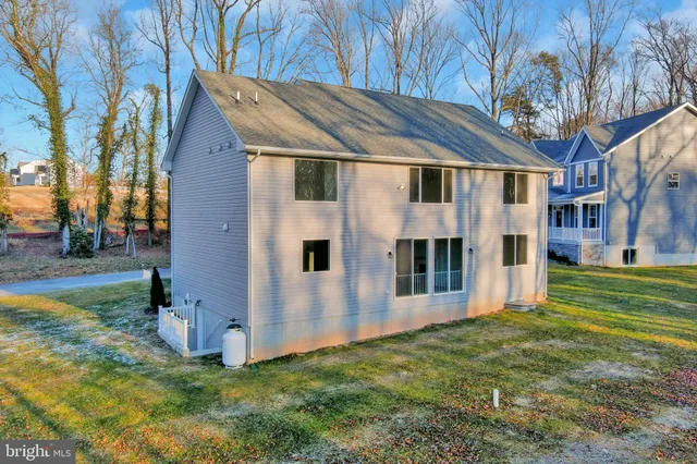 a view of a backyard with large trees