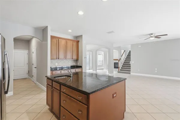 a kitchen with a sink and cabinets