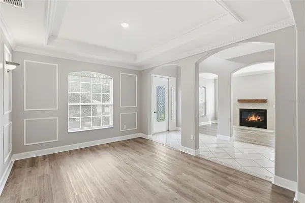 a view of empty room with wooden floor and sliding door