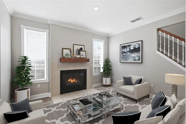 a living room with furniture and a fireplace