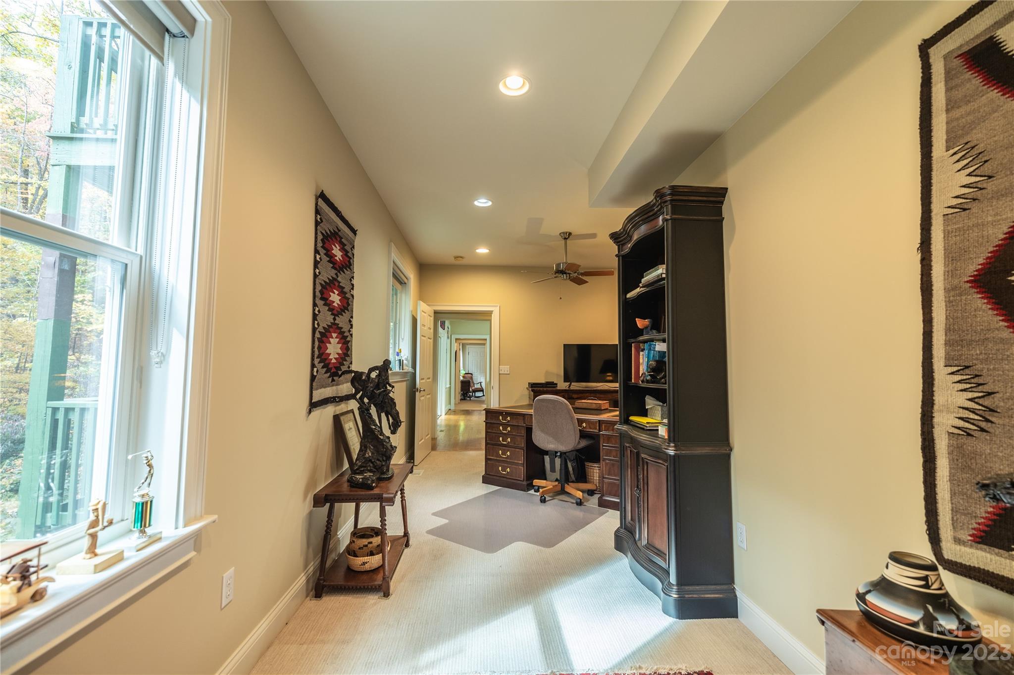 41 Silk Tree Road Hendersonville, NC 28739 - Photo 19 of 32 a view of a workspace with furniture and a window