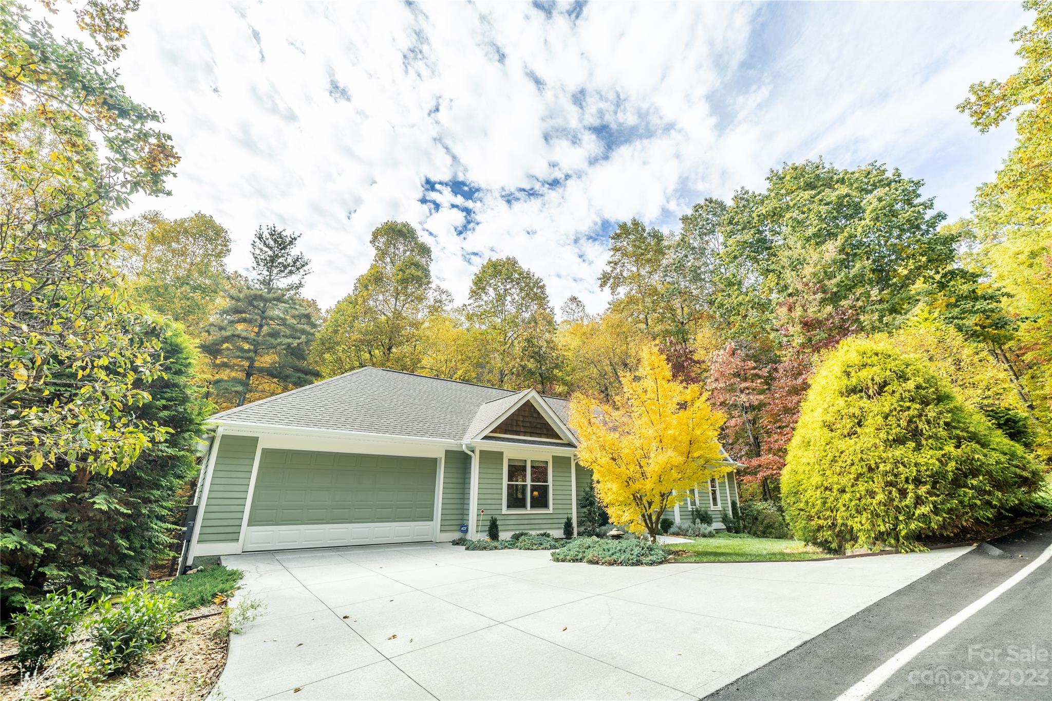 41 Silk Tree Road Hendersonville, NC 28739 - Photo 2 of 32 a front view of a house with a yard and trees