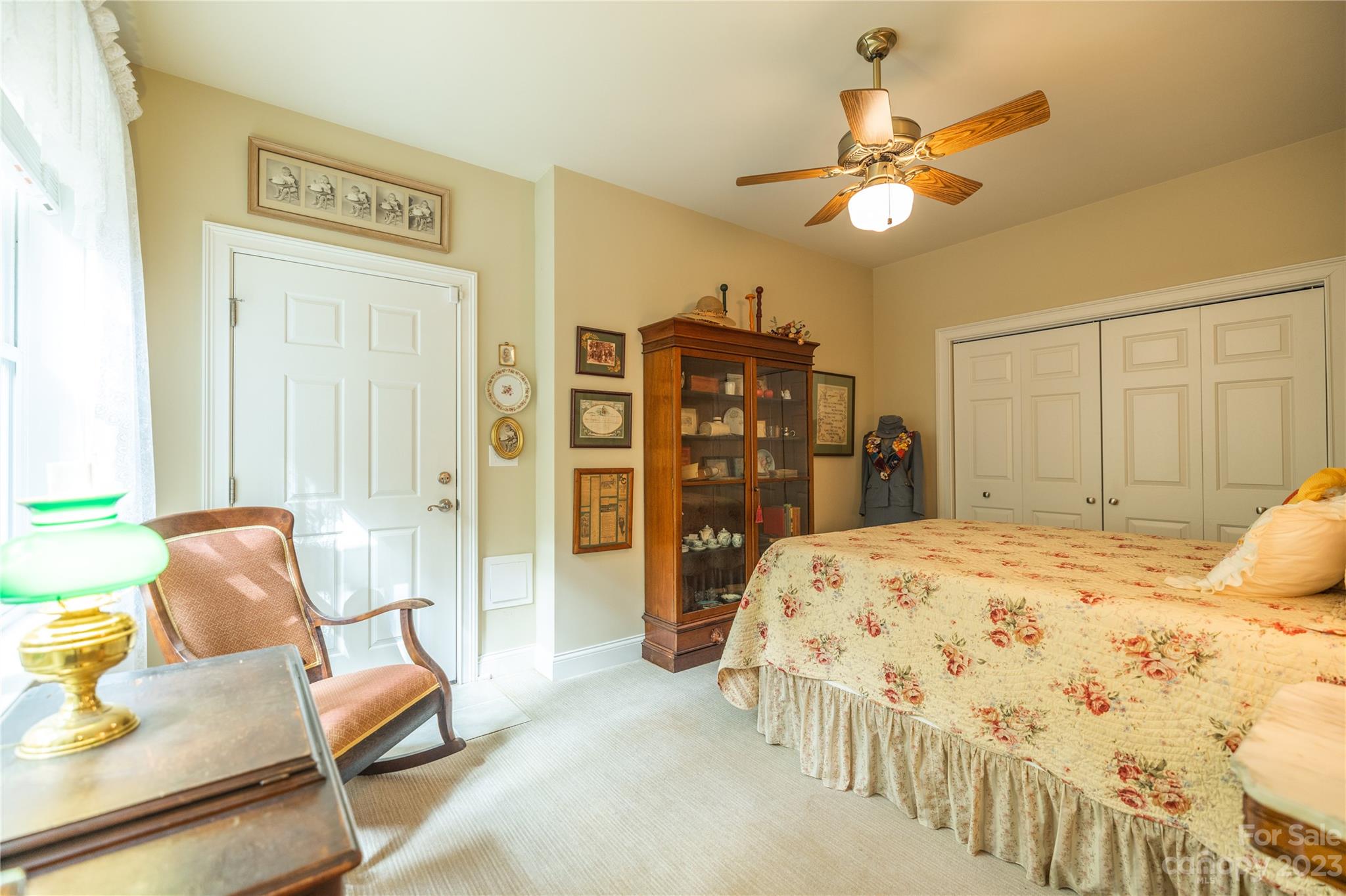 41 Silk Tree Road Hendersonville, NC 28739 - Photo 22 of 32 a bedroom with a bed and ceiling fan
