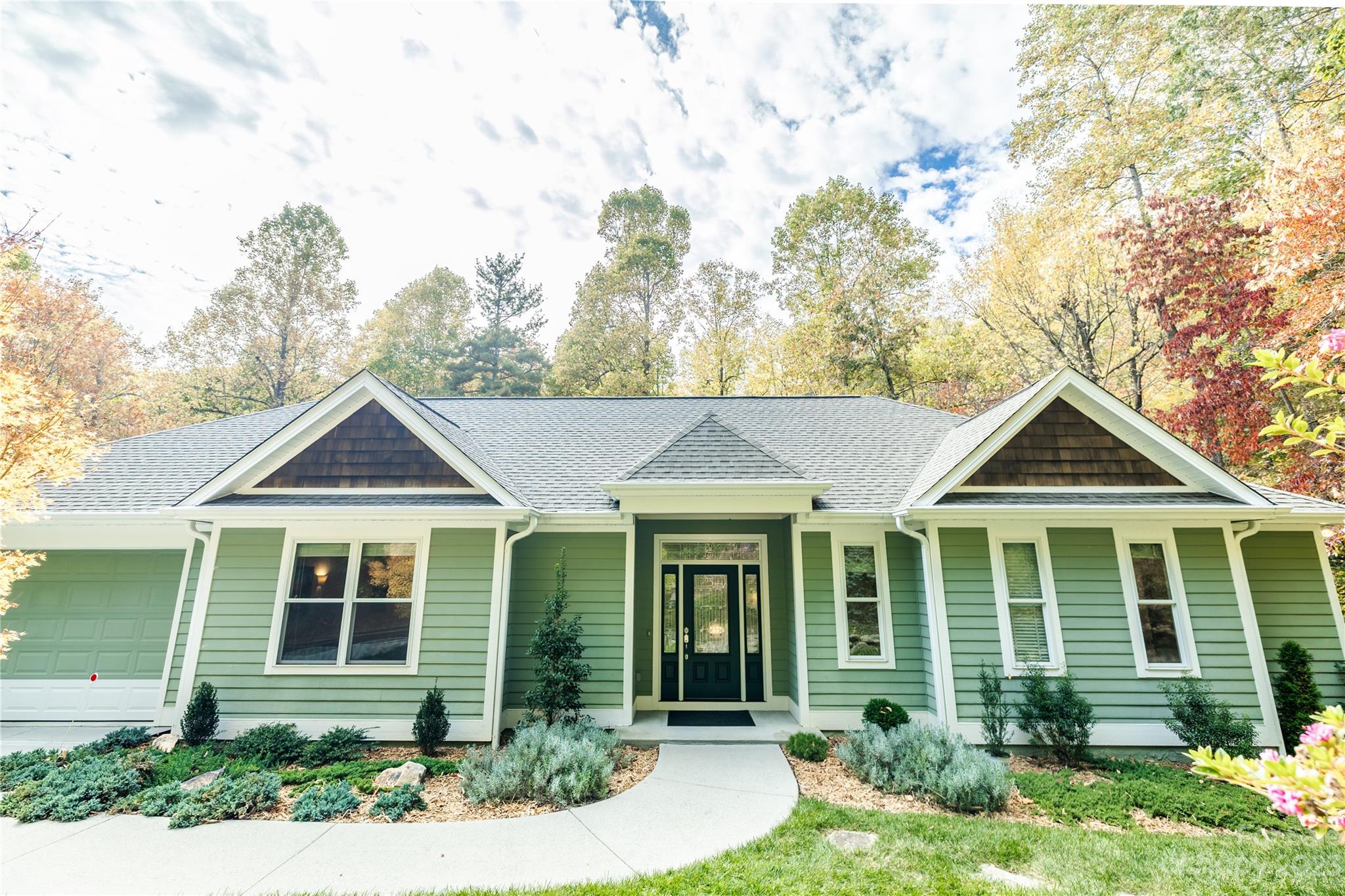 41 Silk Tree Road Hendersonville, NC 28739 - Photo 24 of 32 a front view of a house with garden