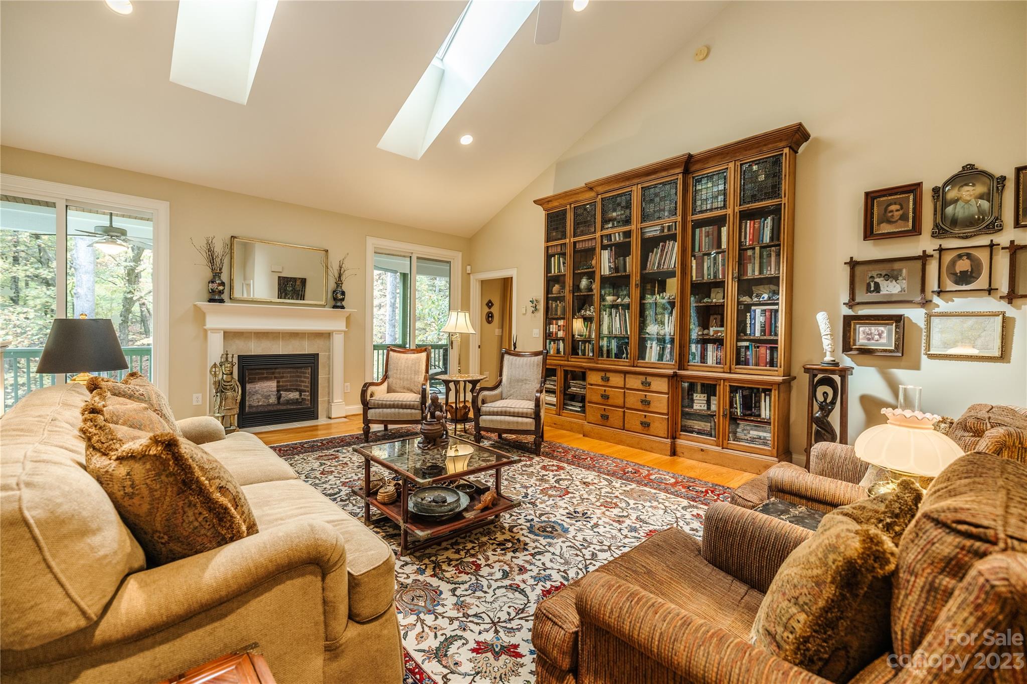 41 Silk Tree Road Hendersonville, NC 28739 - Photo 3 of 32 a living room with furniture a couch and a fireplace