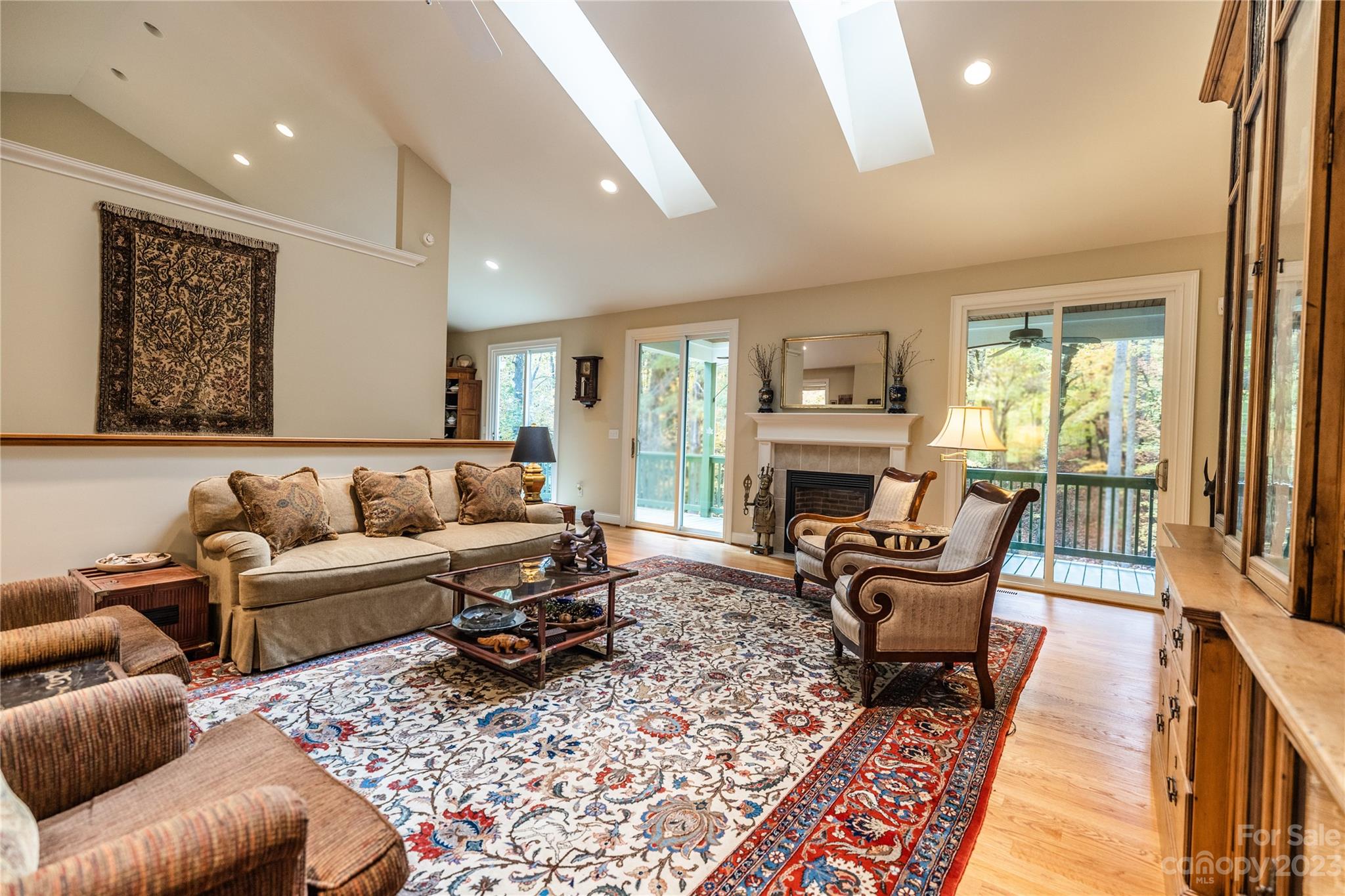 41 Silk Tree Road Hendersonville, NC 28739 - Photo 4 of 32 a living room with furniture fireplace and a large window
