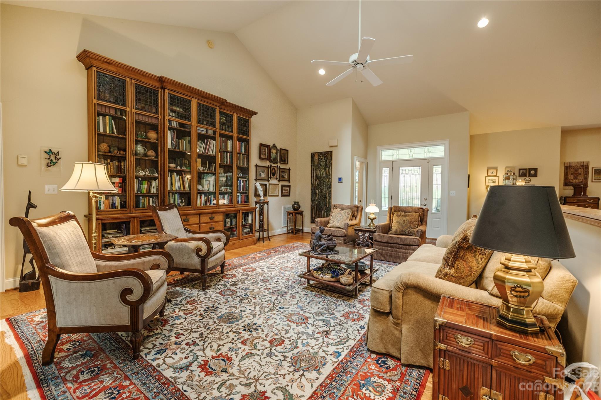 41 Silk Tree Road Hendersonville, NC 28739 - Photo 5 of 32 a living room with furniture or couch and a bookshelf