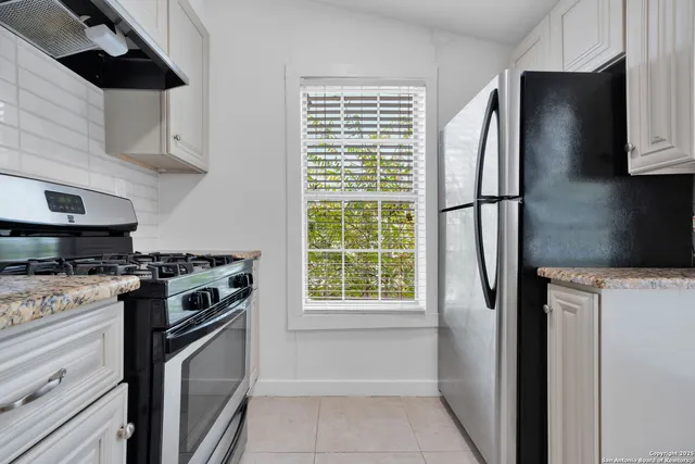 a kitchen with a stove microwave and refrigerator
