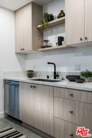 a kitchen with a cabinets and potted plant