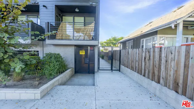a view of a house with backyard and porch