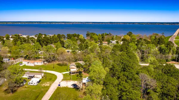 a view of a swimming pool with an outdoor space and seating area