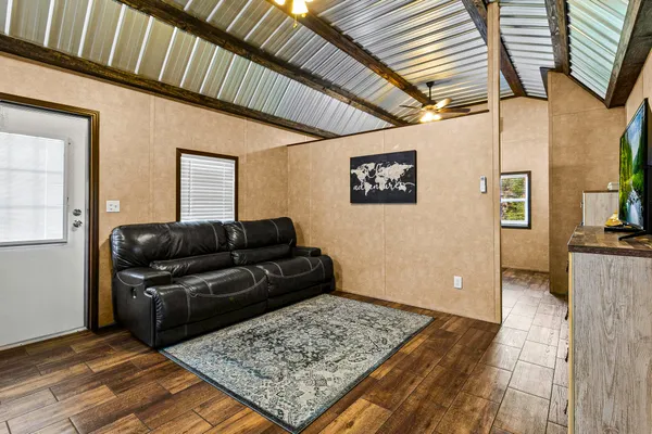 a living room with furniture and a rug
