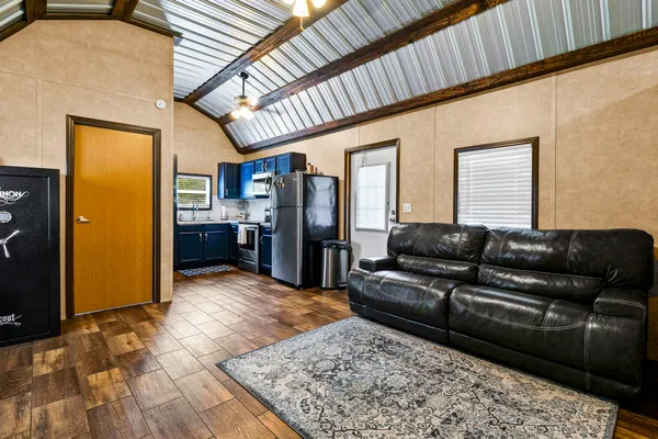 a living room with furniture and a rug