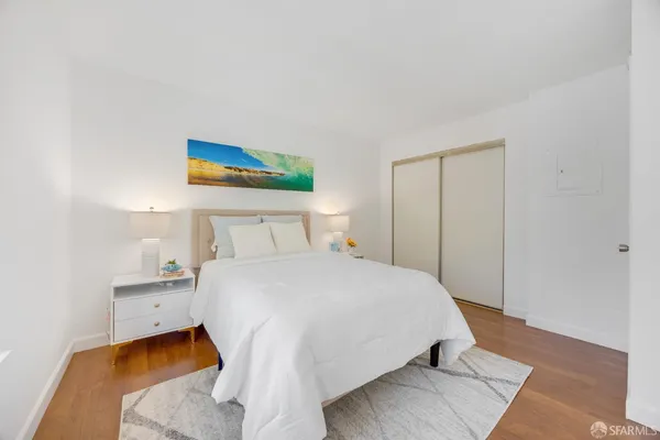 a bedroom with a bed and a couch