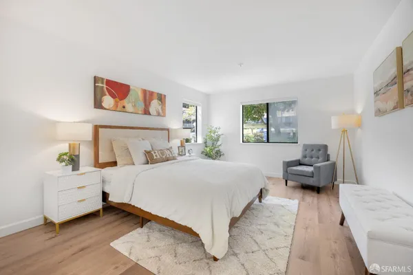 a bedroom with a bed and a couch