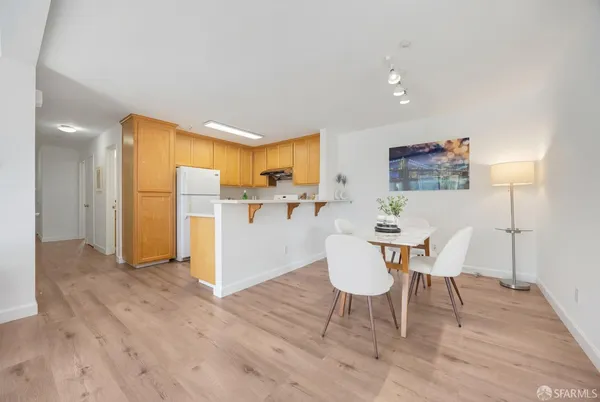 a view of kitchen and dining room with wooden floor