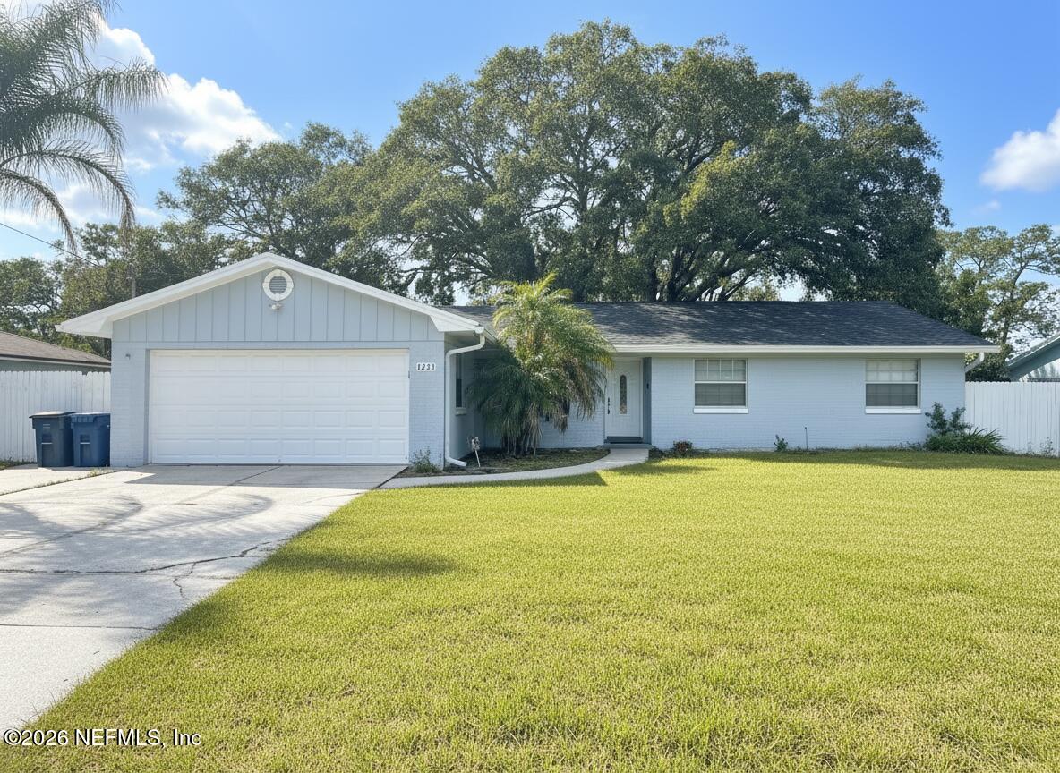 1516 Derringer Road Jacksonville, FL 32225 - Photo 1 of 55 a front view of a house with yard and tree