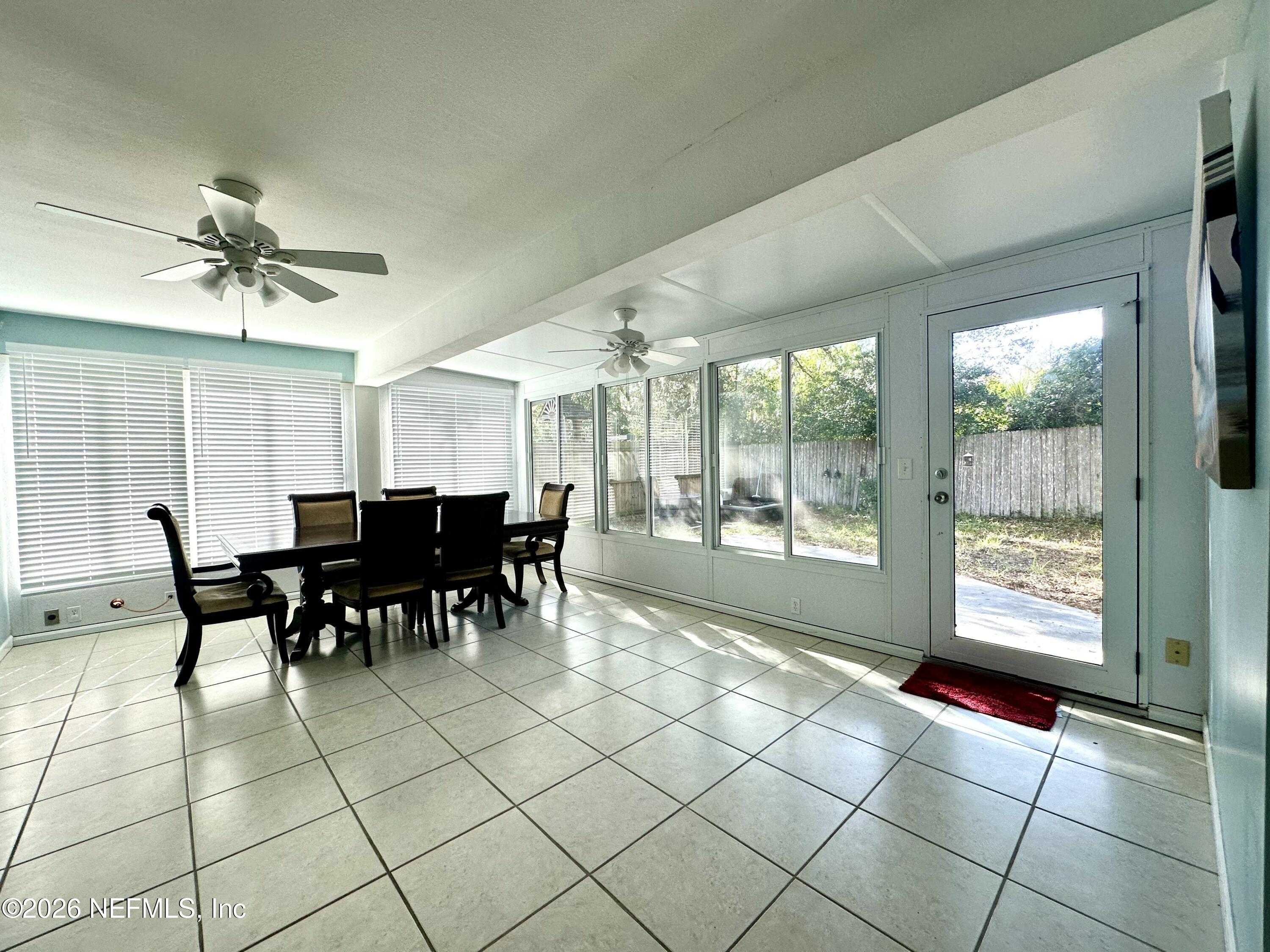 1516 Derringer Road Jacksonville, FL 32225 - Photo 29 of 55 a view of a dining hall with furniture and a window