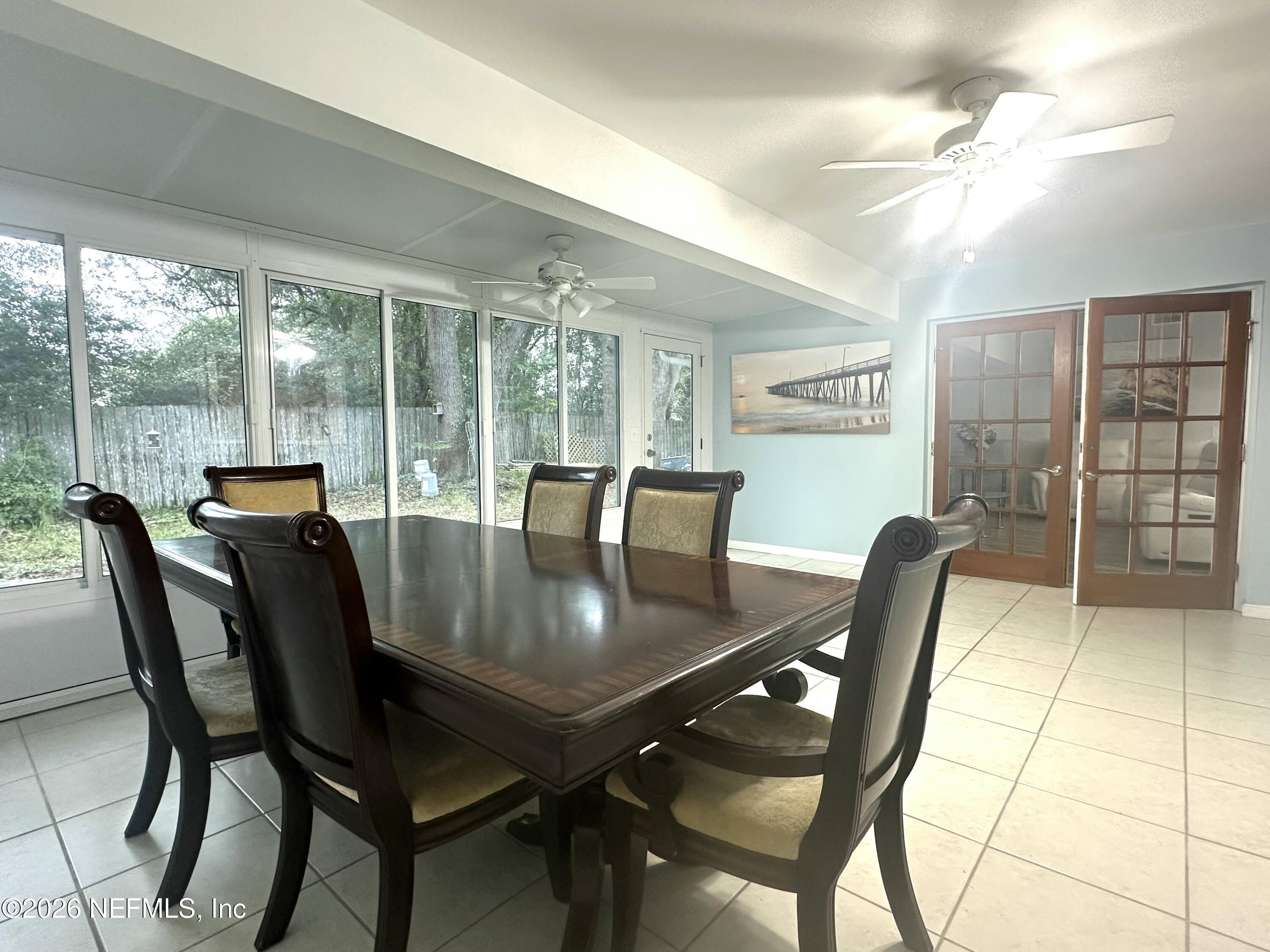 1516 Derringer Road Jacksonville, FL 32225 - Photo 31 of 55 a view of a dining room with furniture and wooden floor