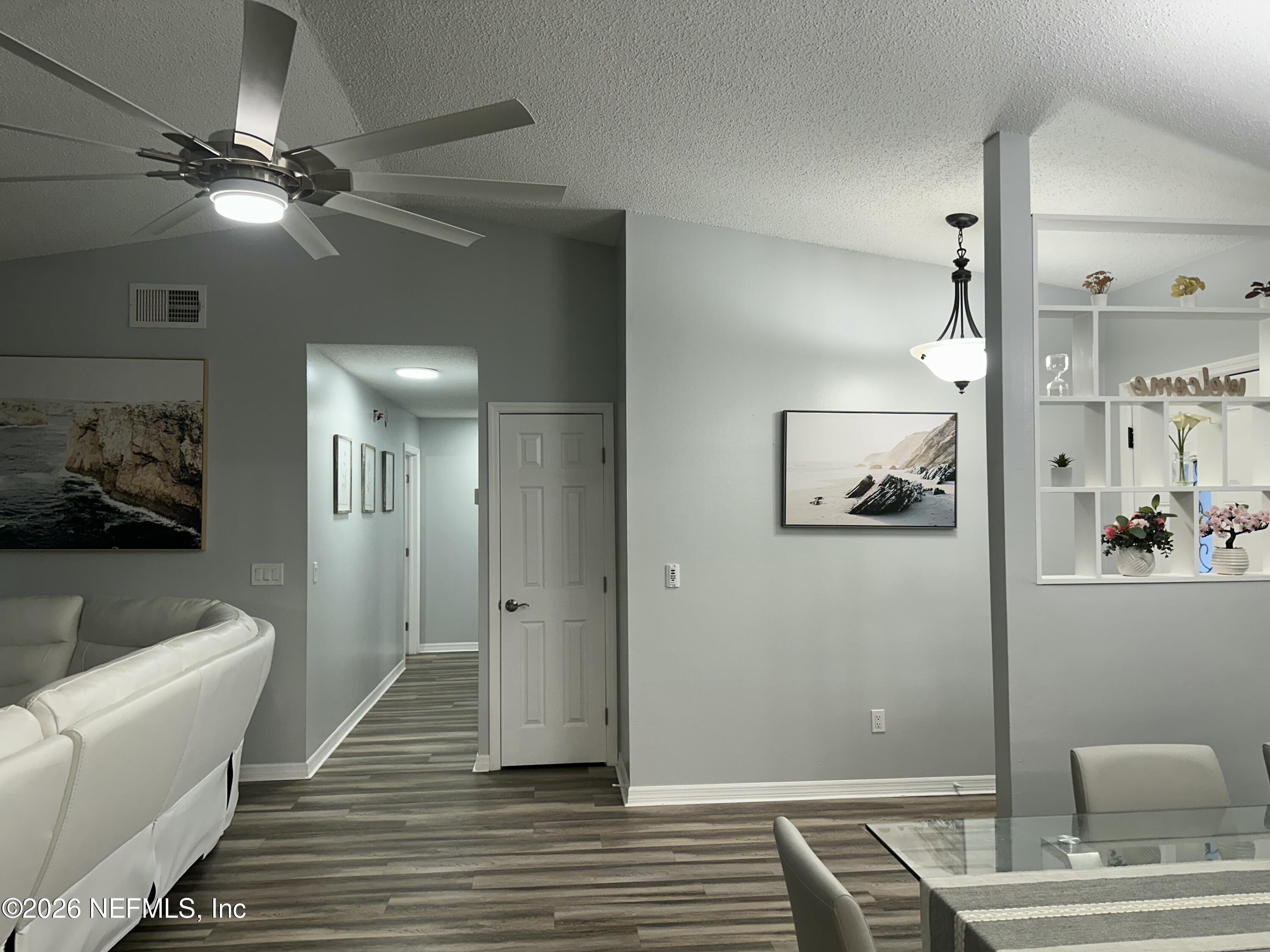 1516 Derringer Road Jacksonville, FL 32225 - Photo 33 of 55 a view of a hallway with wooden floor and furniture