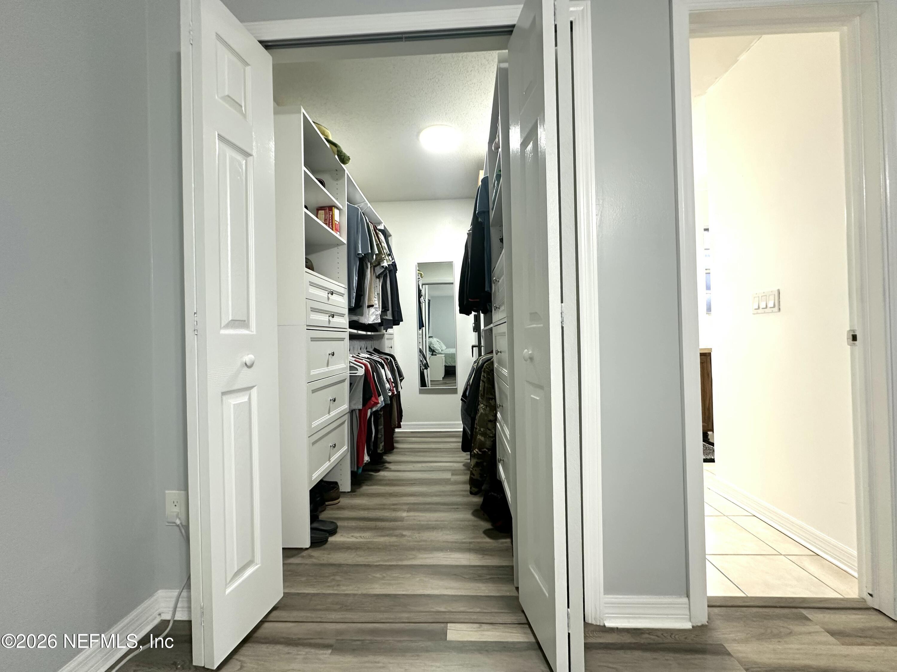 1516 Derringer Road Jacksonville, FL 32225 - Photo 44 of 55 a view of a hallway with wooden floor and staircase