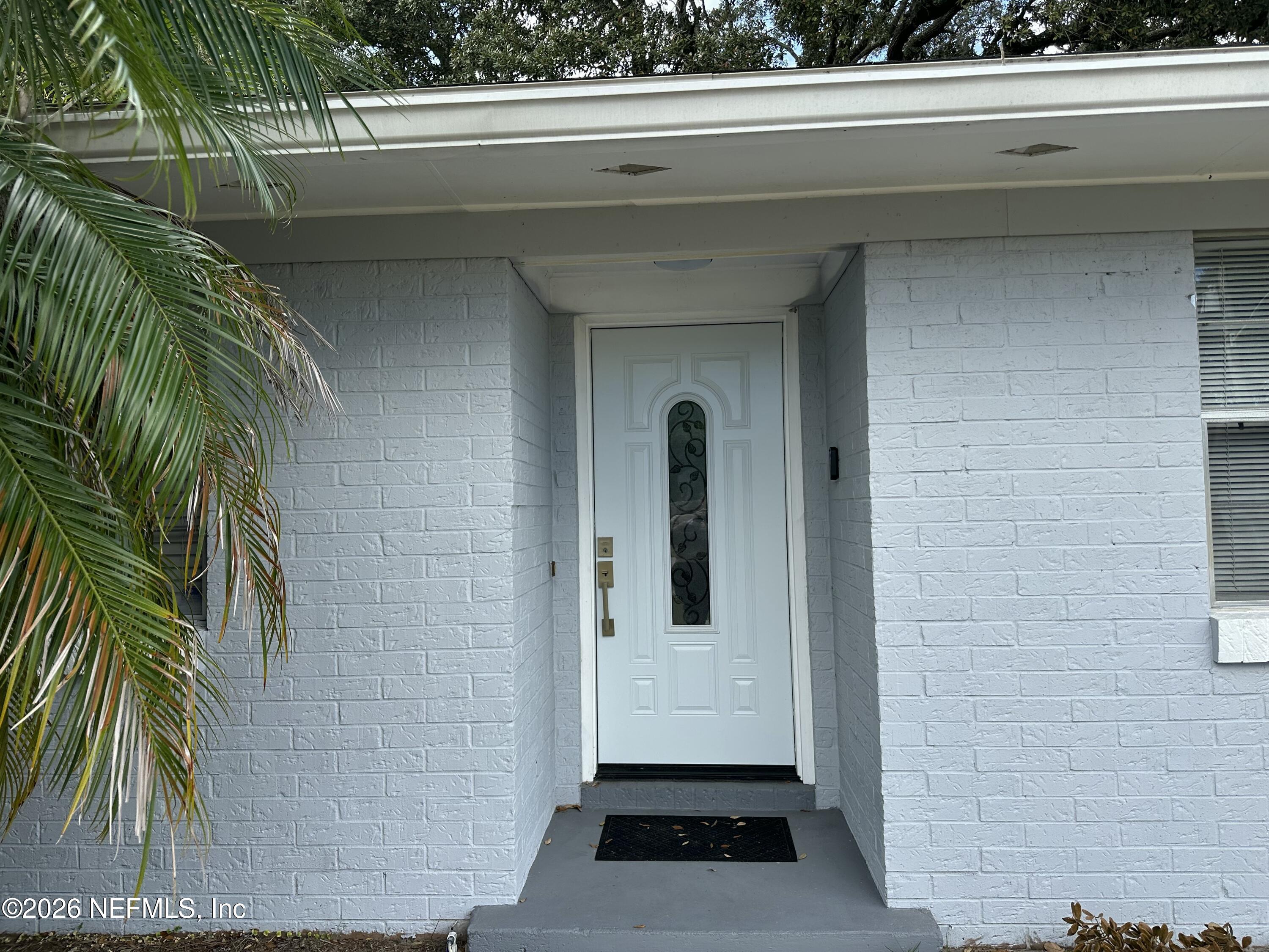 1516 Derringer Road Jacksonville, FL 32225 - Photo 5 of 55 a view of a door and a window