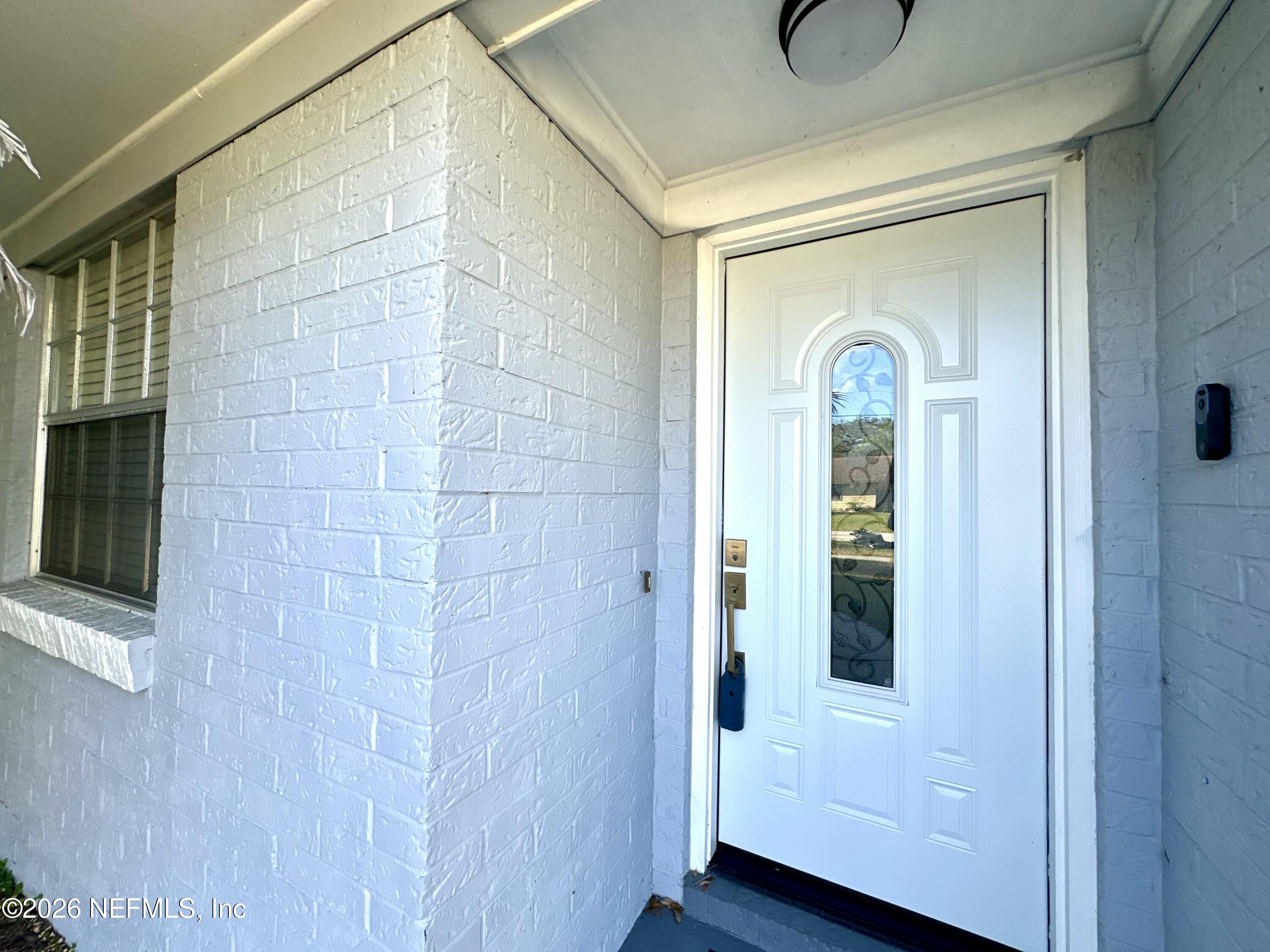 1516 Derringer Road Jacksonville, FL 32225 - Photo 6 of 55 a view of an entryway with wooden floor