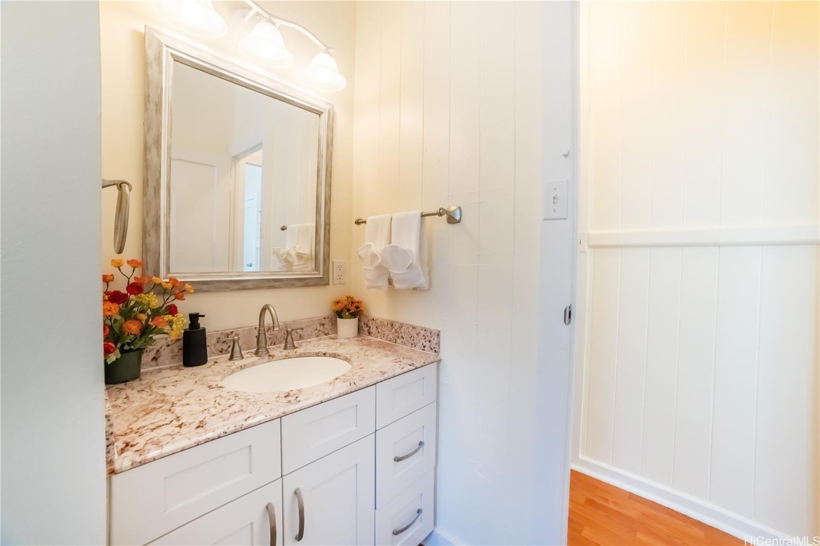 303 Wai Nani Way Honolulu, HI 96815 - Photo 15 of 24 a bathroom with a sink and a mirror