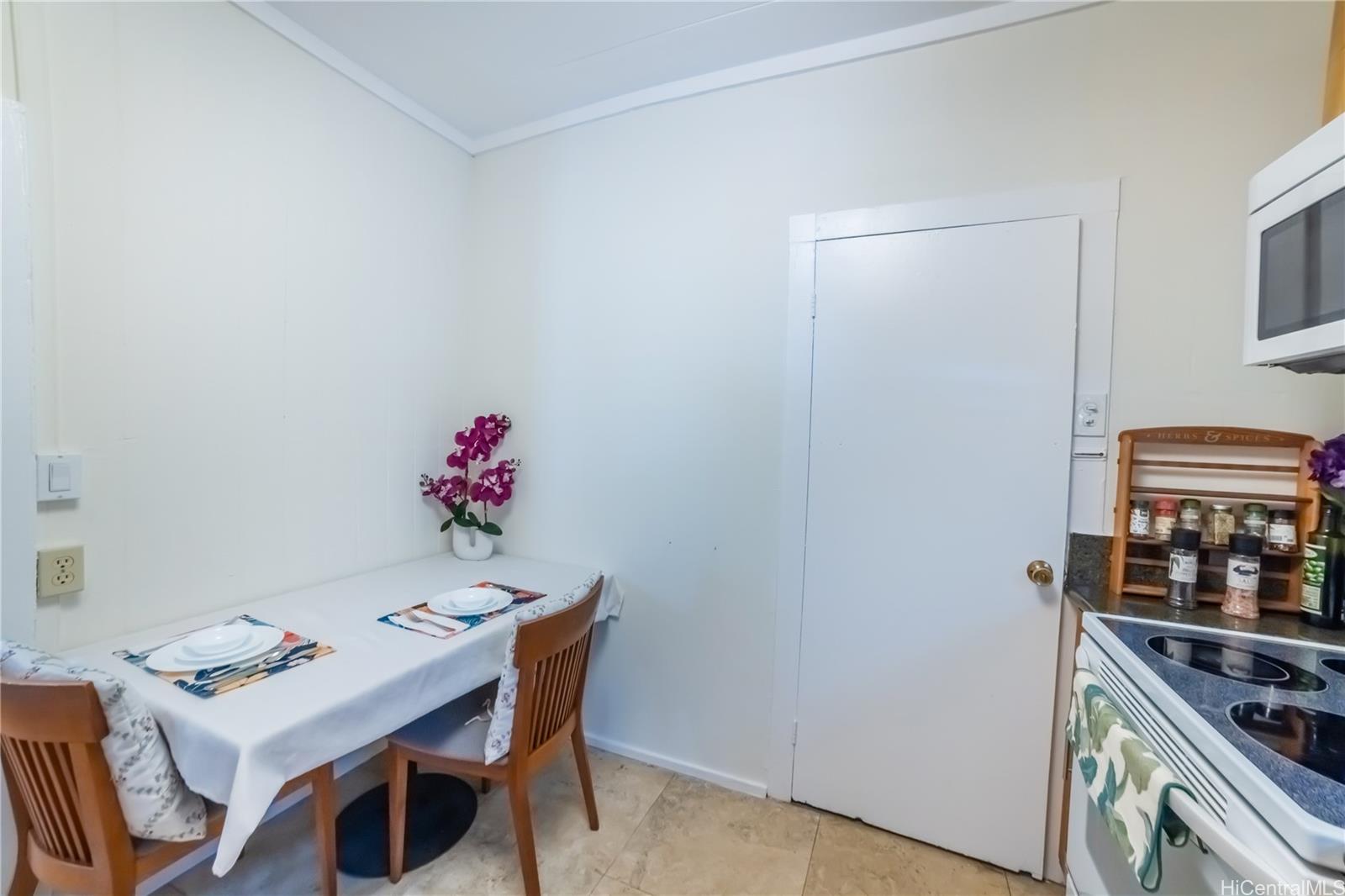 303 Wai Nani Way Honolulu, HI 96815 - Photo 19 of 24 a dining room with furniture and wooden floor