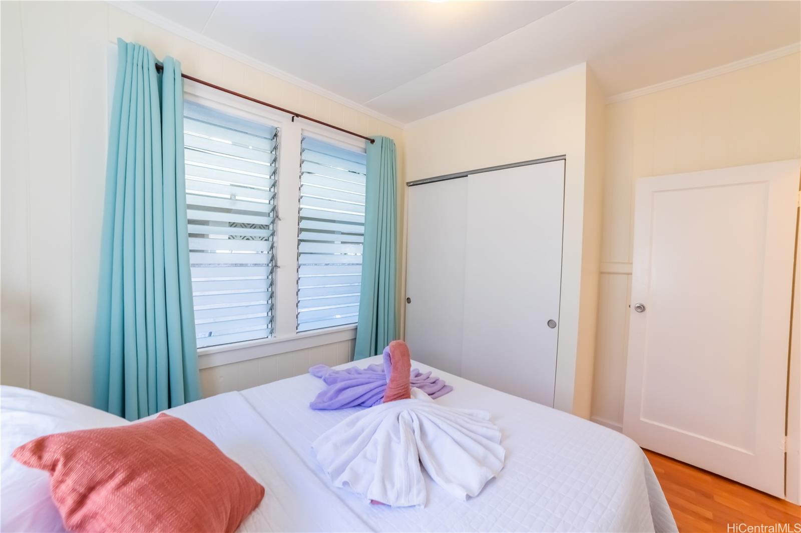 303 Wai Nani Way Honolulu, HI 96815 - Photo 3 of 24 a bedroom with a bed and a window
