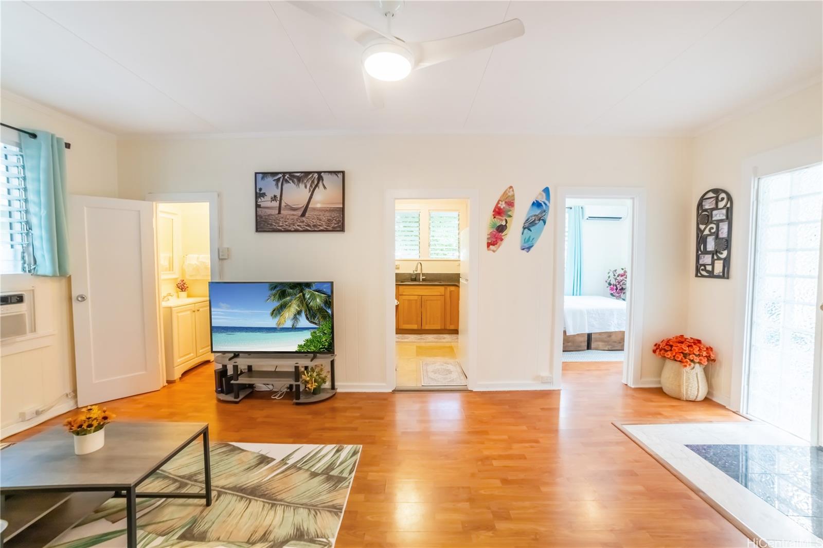 303 Wai Nani Way Honolulu, HI 96815 - Photo 9 of 24 a living room with furniture and a wooden floor
