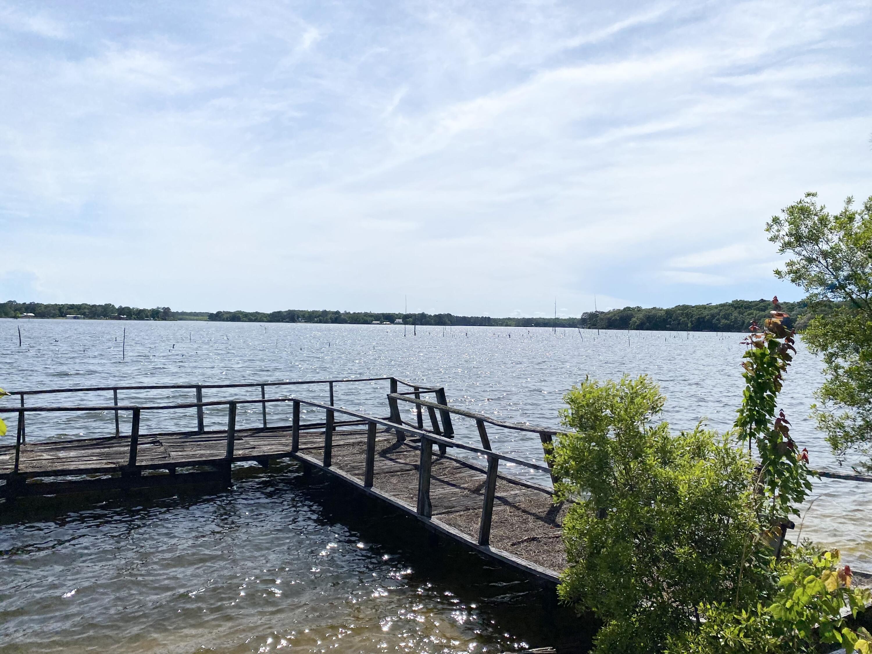 362 Wesley Road DeFuniak Springs, FL 32433 - Photo 6 of 10 a view of a lake with sitting area