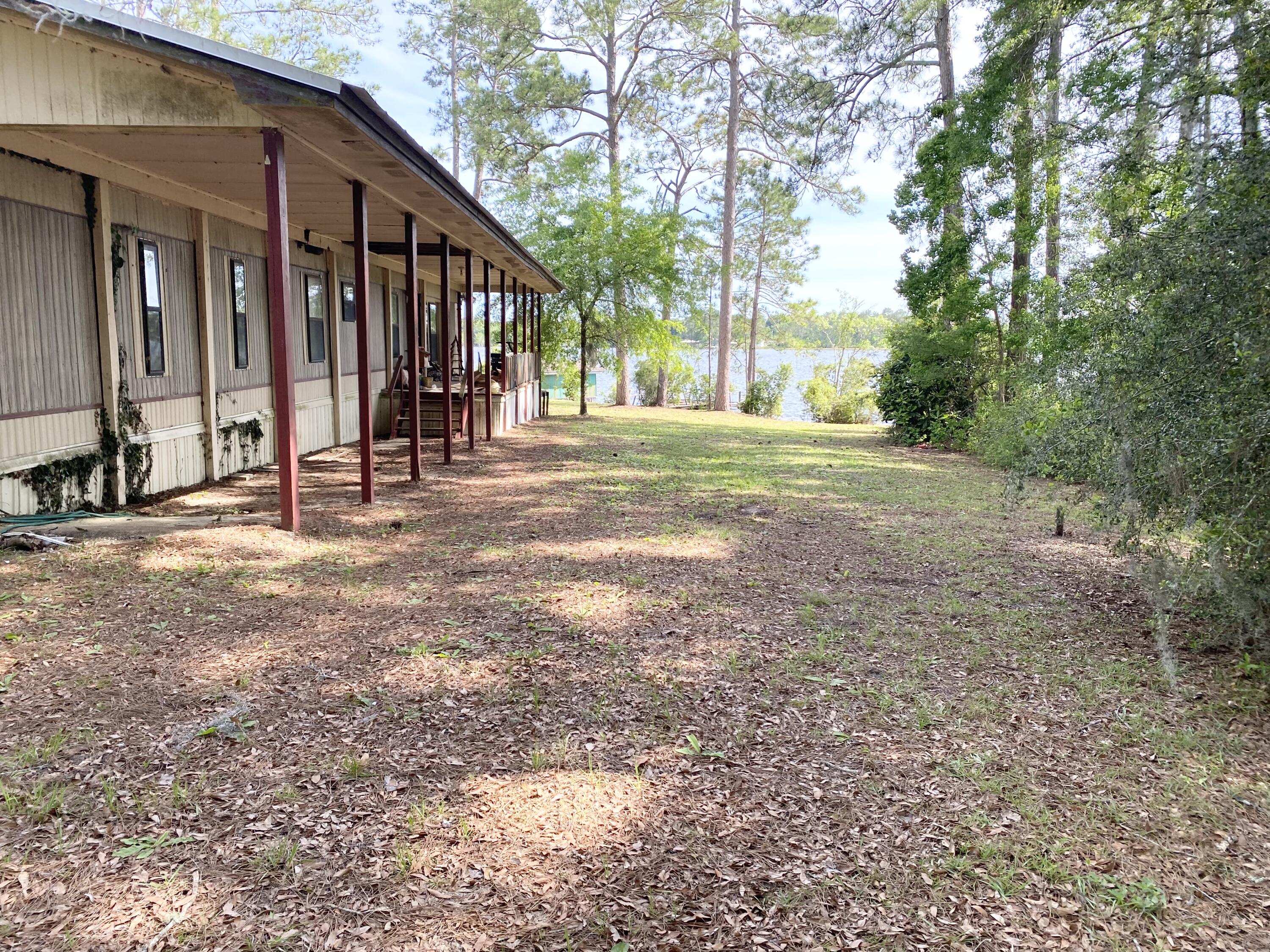 362 Wesley Road DeFuniak Springs, FL 32433 - Photo 10 of 10 a view of a house with backyard and trees