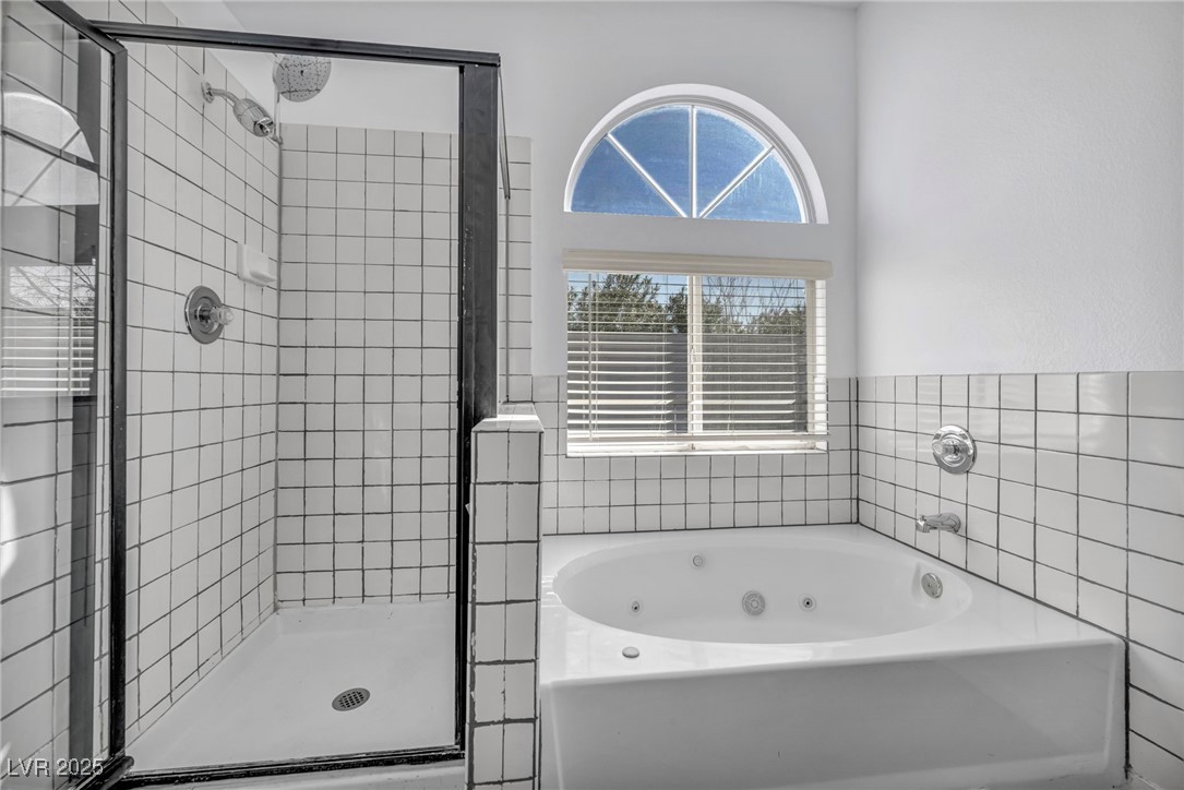 7308 Alpine Ridge Street Las Vegas, NV 89131 - Photo 24 of 47 Full bath with a tub with jets and a shower stall