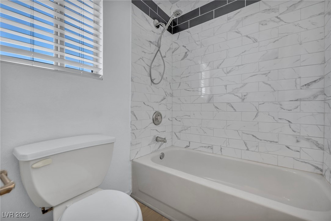7308 Alpine Ridge Street Las Vegas, NV 89131 - Photo 33 of 47 Bathroom featuring toilet and bathing tub / shower combination