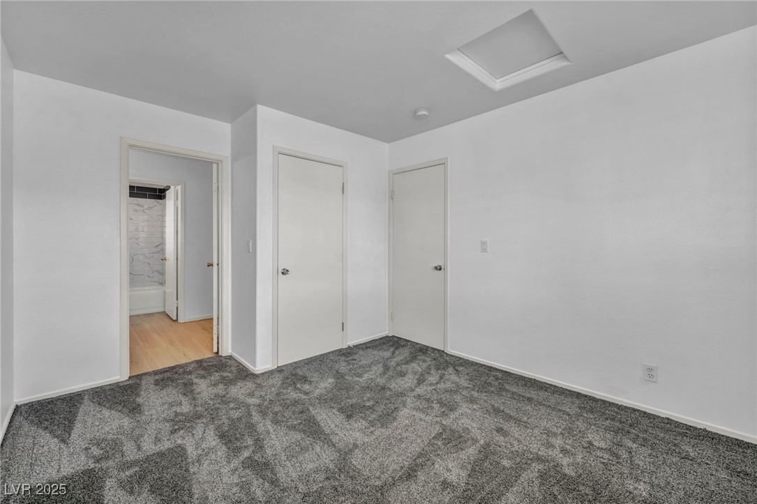 7308 Alpine Ridge Street Las Vegas, NV 89131 - Photo 35 of 47 Unfurnished bedroom with carpet floors and attic access