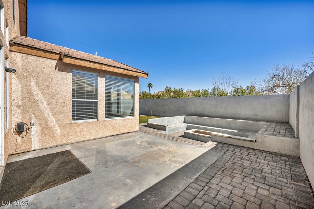 7308 Alpine Ridge Street Las Vegas, NV 89131 - Photo 37 of 47 View of patio featuring a fenced backyard