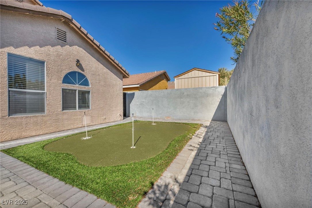 7308 Alpine Ridge Street Las Vegas, NV 89131 - Photo 43 of 47 View of yard with a fenced backyard