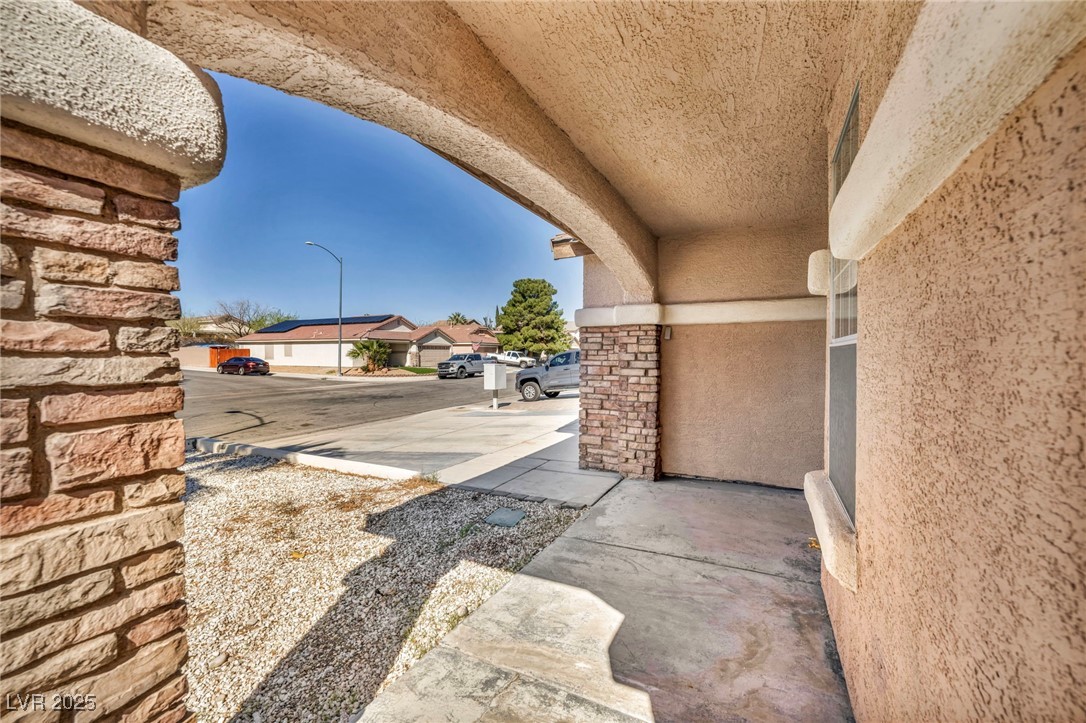 7308 Alpine Ridge Street Las Vegas, NV 89131 - Photo 5 of 47 View of patio featuring a residential view