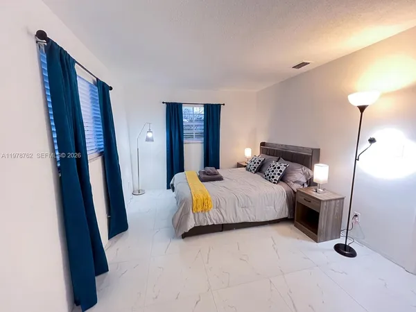 a bedroom with a bed and a walk in closet