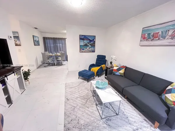 a living room with furniture or couch and a flat screen tv