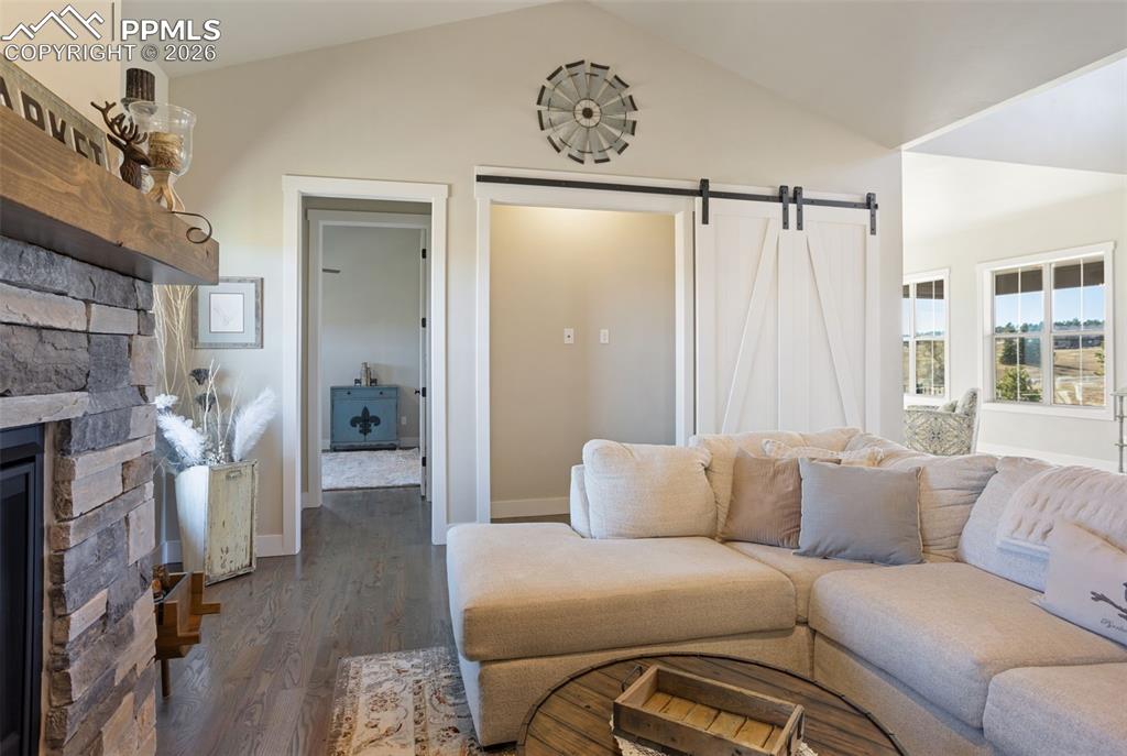 16835 Goshawk Road Colorado Springs, CO 80908 - Photo 13 of 50 a living room with furniture and a fireplace