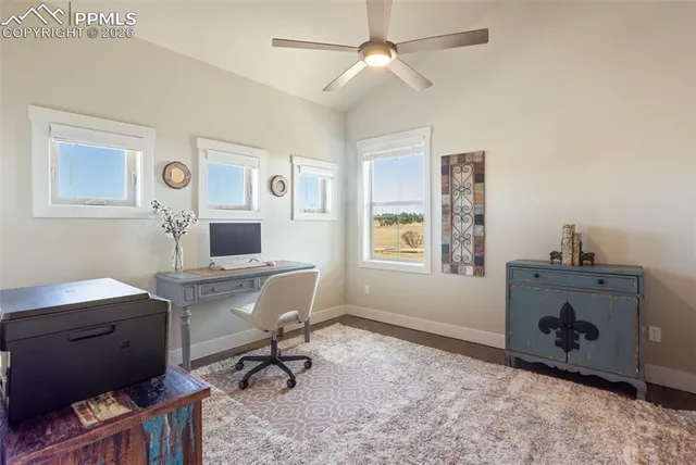 a workspace with furniture and window