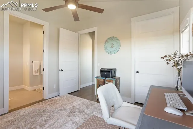 a work room with furniture and chandelier